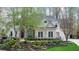 Charming two-story home with manicured front yard, stone steps, and flowering trees at 2305 Whiting Bay Cts, Kennesaw, GA 30152