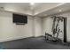 Home gym with rubber flooring, modern equipment, and a wall-mounted TV at 2305 Whiting Bay Cts, Kennesaw, GA 30152
