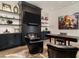 Modern home office with custom built-ins, fireplace, and comfortable seating area at 2305 Whiting Bay Cts, Kennesaw, GA 30152