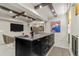 Spacious island with dark cabinets, granite countertop, and luxury appliances at 2305 Whiting Bay Cts, Kennesaw, GA 30152