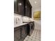 Well-equipped laundry room with custom cabinets, marble counters, and modern appliances at 2305 Whiting Bay Cts, Kennesaw, GA 30152