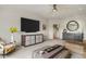 Spacious living room with a flat screen tv, large couch, and stylish decor at 2305 Whiting Bay Cts, Kennesaw, GA 30152