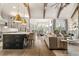 Open concept living space with a kitchen island, dining area, and comfortable living room at 2305 Whiting Bay Cts, Kennesaw, GA 30152