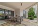 Outdoor dining space featuring a stone patio and a view of the backyard and pool at 2305 Whiting Bay Cts, Kennesaw, GA 30152