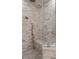 Shower stall with marble tiles, seat and clear glass door at 2305 Whiting Bay Cts, Kennesaw, GA 30152