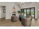A cozy sitting area with fireplace and pool view offering a stylish and relaxing retreat at 2305 Whiting Bay Cts, Kennesaw, GA 30152