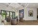 Relaxing sitting area with modern decor, stylish chairs, and views of the backyard pool at 2305 Whiting Bay Cts, Kennesaw, GA 30152