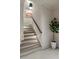 Interior view of stairs with carpeted steps and plant at 2305 Whiting Bay Cts, Kennesaw, GA 30152