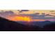 Stunning sunset view over the mountains, with vibrant colors illuminating the sky and silhouetting the landscape at 2305 Whiting Bay Cts, Kennesaw, GA 30152