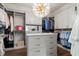Spacious walk-in closet featuring custom shelving, drawers, and a marble-topped center island at 2305 Whiting Bay Cts, Kennesaw, GA 30152