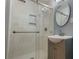 Updated bathroom with a glass-enclosed shower, modern vanity and stylish fixtures at 2744 Hunting Hill Ln, Decatur, GA 30033