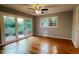 Lovely bedroom featuring hardwood floors, neutral walls, natural lighting, and patio access at 2744 Hunting Hill Ln, Decatur, GA 30033