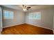 Bedroom boasts hardwood floors and window shutters, with lots of natural light at 2744 Hunting Hill Ln, Decatur, GA 30033