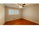 Bedroom with hardwood floors, a ceiling fan, and natural light from a window at 2744 Hunting Hill Ln, Decatur, GA 30033