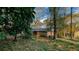 Charming single-story brick home nestled among mature trees in a quiet, wooded neighborhood at 2744 Hunting Hill Ln, Decatur, GA 30033