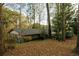 Exterior view of a well-maintained home surrounded by mature trees at 2744 Hunting Hill Ln, Decatur, GA 30033