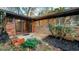 Brick home featuring a sliding glass door leading to an outdoor space with mature landscaping at 2744 Hunting Hill Ln, Decatur, GA 30033