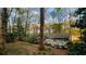 A peaceful view of the home amidst blooming bushes, showcasing the serene setting at 2744 Hunting Hill Ln, Decatur, GA 30033