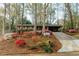 Exterior shot showcasing blooming flowers and a long driveway at 2744 Hunting Hill Ln, Decatur, GA 30033