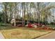 Charming home nestled among tall trees, with vibrant azaleas lining the yard at 2744 Hunting Hill Ln, Decatur, GA 30033