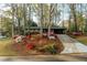 Beautifully landscaped home with colorful azaleas enhancing its curb appeal and a long driveway at 2744 Hunting Hill Ln, Decatur, GA 30033