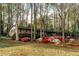 Well-kept home with a yard featuring colorful azaleas and towering trees at 2744 Hunting Hill Ln, Decatur, GA 30033
