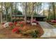Inviting home with a landscaped front yard blooming with azaleas and mature trees at 2744 Hunting Hill Ln, Decatur, GA 30033