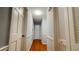 Bright hallway with beautiful hardwood floors, white trim, and closet space at 2744 Hunting Hill Ln, Decatur, GA 30033