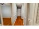 Hallway with hardwood floors connecting various rooms within the home at 2744 Hunting Hill Ln, Decatur, GA 30033