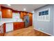 Stylish kitchen with wooden cabinets, stainless steel fridge, and white tile backsplash complementing modern appliances at 2744 Hunting Hill Ln, Decatur, GA 30033
