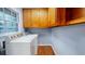 A bright laundry room with a window and side-by-side washer and dryer at 2744 Hunting Hill Ln, Decatur, GA 30033
