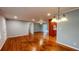 Open-concept living room boasts hardwood floors, neutral paint, bright lighting, and easy access to the kitchen at 2744 Hunting Hill Ln, Decatur, GA 30033