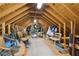 Large attic space with exposed beams, storage, and potential for future conversion at 5533 Woodridge Ln, Douglasville, GA 30135