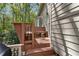 Exterior deck with bench seating and a view of the home's siding and outdoor features at 5533 Woodridge Ln, Douglasville, GA 30135