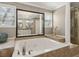 This bathroom features a jacuzzi tub, standalone shower, and large mirror at 5533 Woodridge Ln, Douglasville, GA 30135