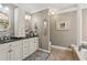 Bathroom features double sinks, granite countertop, and a large soaking tub at 5533 Woodridge Ln, Douglasville, GA 30135