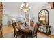 Inviting dining room featuring wood floors, classic decor, and seamless connection to the living area at 5533 Woodridge Ln, Douglasville, GA 30135