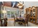 Dining room with wood floors, a china cabinet and windows offering natural light and outdoor views at 5533 Woodridge Ln, Douglasville, GA 30135