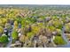 Beautiful aerial view of a neighborhood with lush green trees and well-maintained homes at 825 Clarion Way, Lawrenceville, GA 30044