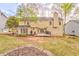 Spacious backyard featuring a patio and ample green space, perfect for outdoor living at 825 Clarion Way, Lawrenceville, GA 30044