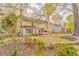 View of the home's exterior, landscaping, and wooden deck in the backyard at 825 Clarion Way, Lawrenceville, GA 30044