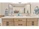 Bathroom with double sink vanity, modern fixtures, and a large mirror at 825 Clarion Way, Lawrenceville, GA 30044