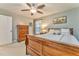 Bedroom features a wooden bed frame, neutral walls, and a view of the backyard at 825 Clarion Way, Lawrenceville, GA 30044