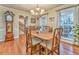 Dining room with a decorative chandelier and hardwood floors, next to stairway at 825 Clarion Way, Lawrenceville, GA 30044