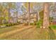 Charming two-story home with a welcoming front porch, a two-car garage, and a lush front lawn at 825 Clarion Way, Lawrenceville, GA 30044