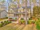 Charming two-story home with a welcoming front porch and beautifully landscaped front yard at 825 Clarion Way, Lawrenceville, GA 30044