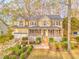 Charming two-story home with a welcoming front porch and beautifully landscaped front yard at 825 Clarion Way, Lawrenceville, GA 30044