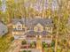 Charming two-story home with a welcoming front porch, two-car garage, and mature landscaping at 825 Clarion Way, Lawrenceville, GA 30044