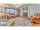 Living room features a stone fireplace and hardwood floors at 825 Clarion Way, Lawrenceville, GA 30044