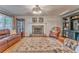 Living room features a stone fireplace and hardwood floors at 825 Clarion Way, Lawrenceville, GA 30044